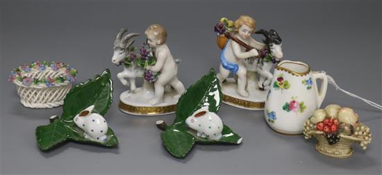 A Royal Doulton miniature jug, a pair of models of amorini with goats and sundry small items